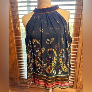 Beautiful, sleeveless blouse with beading.